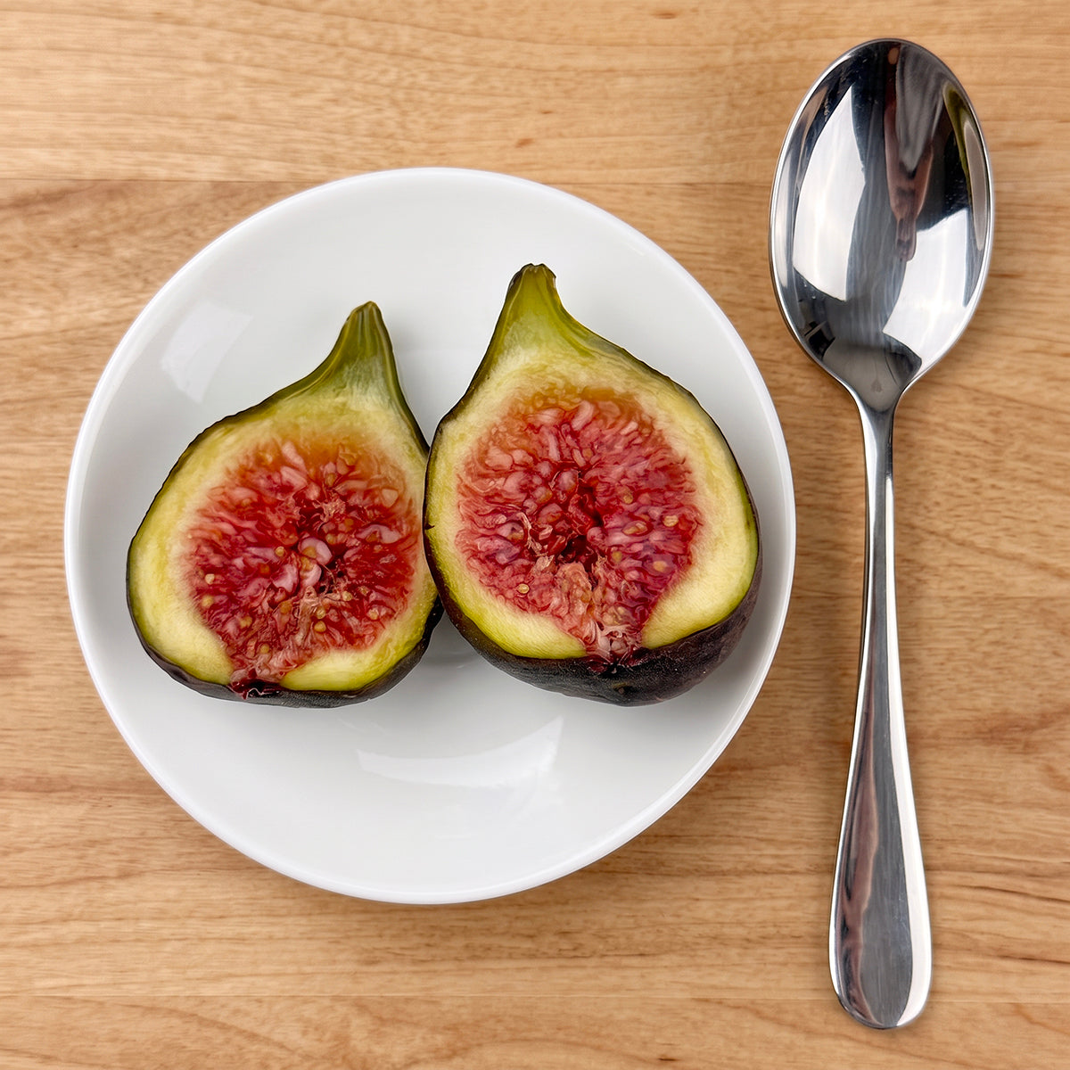 Hartford Hardy Fig cut open with a red fleshy interior